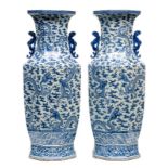 An imposing Chinese pair of octagonal vases, blue and white decorated with dragons and flaming