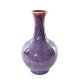 A Chinese flambé-glazed bottle vase, 19thC, H 38,5 cm (chips to the bottom rim)