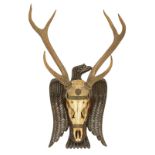 A hunting trophy with frame in the shape of an eagle, H 83,5 - B 58 cm