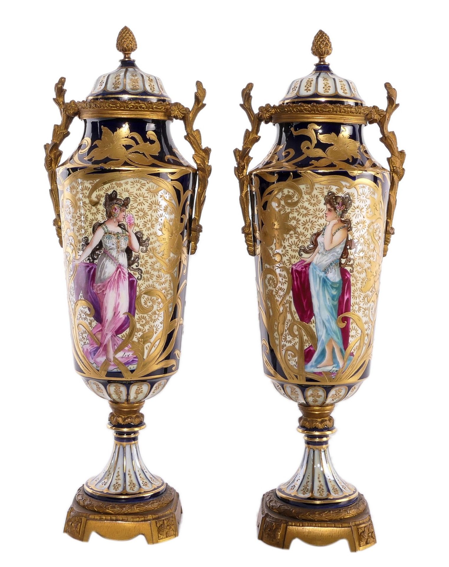 A pair of ornamental vases in Sèvres-porcelain, with gold-layered blue royale ground and bronze