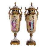 A pair of ornamental vases in Sèvres-porcelain, with gold-layered blue royale ground and bronze