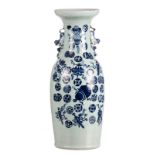 A Chinese celadon ground blue and white and relief decorated vase with auspicious symbols, 19thC,