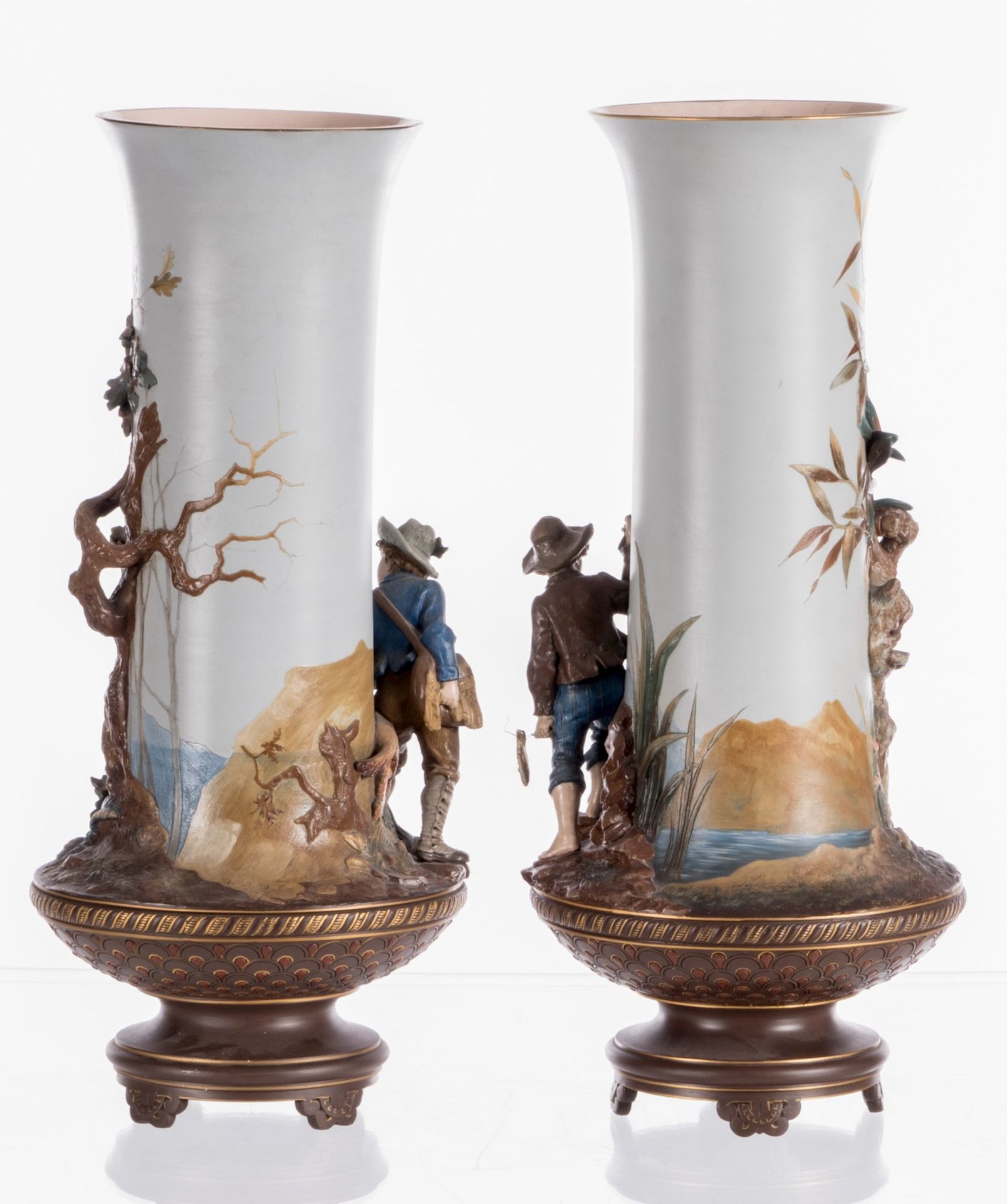 A pair of red stoneware vases, polychrome and partly cold painted relief decoration depicting - Image 2 of 11