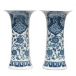 A pair of Chinese blue and white floral decorated vases, 19thC, H 49 cm (one vase with a hairline on