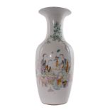 A Chinese polychrome vase, decorated with ladies and children playing in a garden, H 58,5 cm (chip