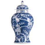 A Chinese blue and white vase and cover overall decorated with plum blossoms, H 48,5 cm (chip)