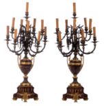 A pair of Neoclassical gilt bronze and 'Rouge Napoleon' marble candlesticks, 19thC, H 100 cm (