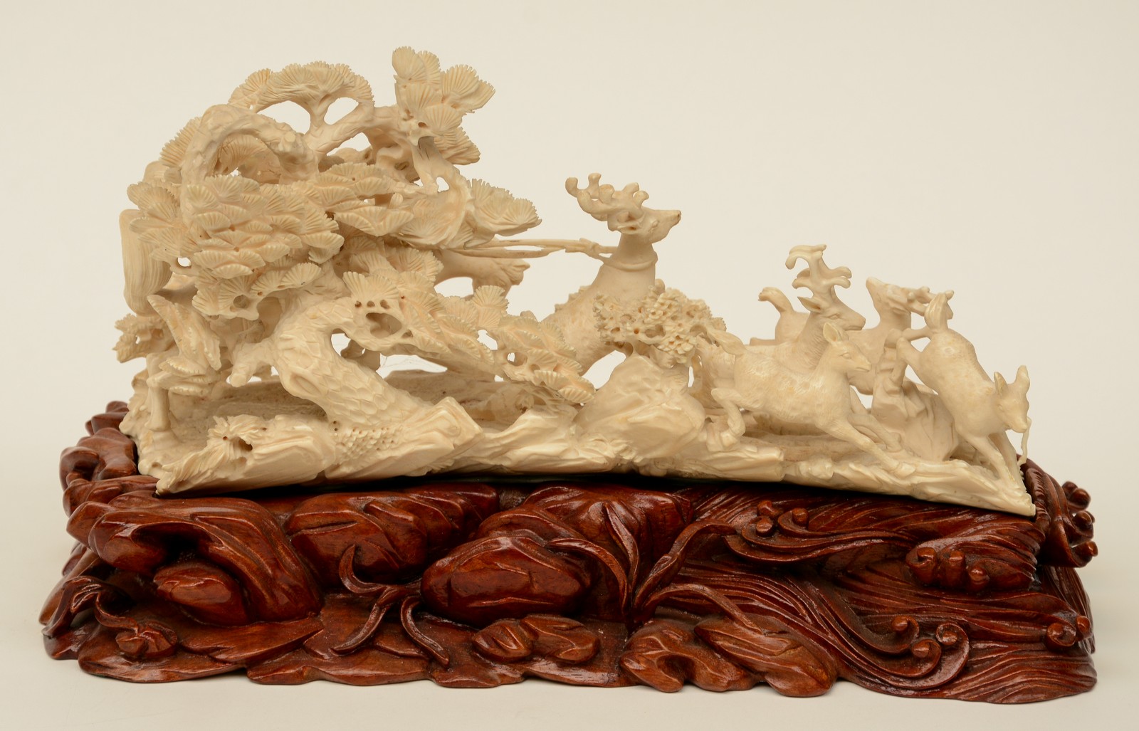 A Chinese ivory group depicting 'young heroes hunting for reindeers' on a carved wooden base, - Image 3 of 9