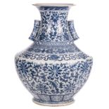 A Chinese blue and white Hu vase, decorated with floral motifs, the handles bamboo moulded, 19thC, H