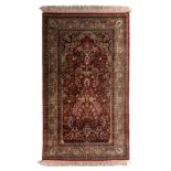 An Oriental prayer carpet, wool on cotton, 90 x 153 cm
