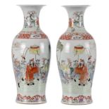 A pair of Chinese famille rose and polychrome baluster shaped vases, overall decorated with a