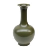 A Chinese monochrome olive green glazed bottle vase, with a blue underglaze mark, H 25 cm