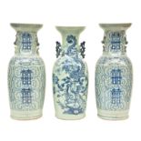 A pair of Chinese celadon ground blue and white decorated vases; added a ditto vase, decorated