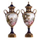 A pair of ornamental vases in Sèvres with gold-layered blue royale ground, decorated with a