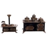 Two tin and brass toy ovens, about 1900