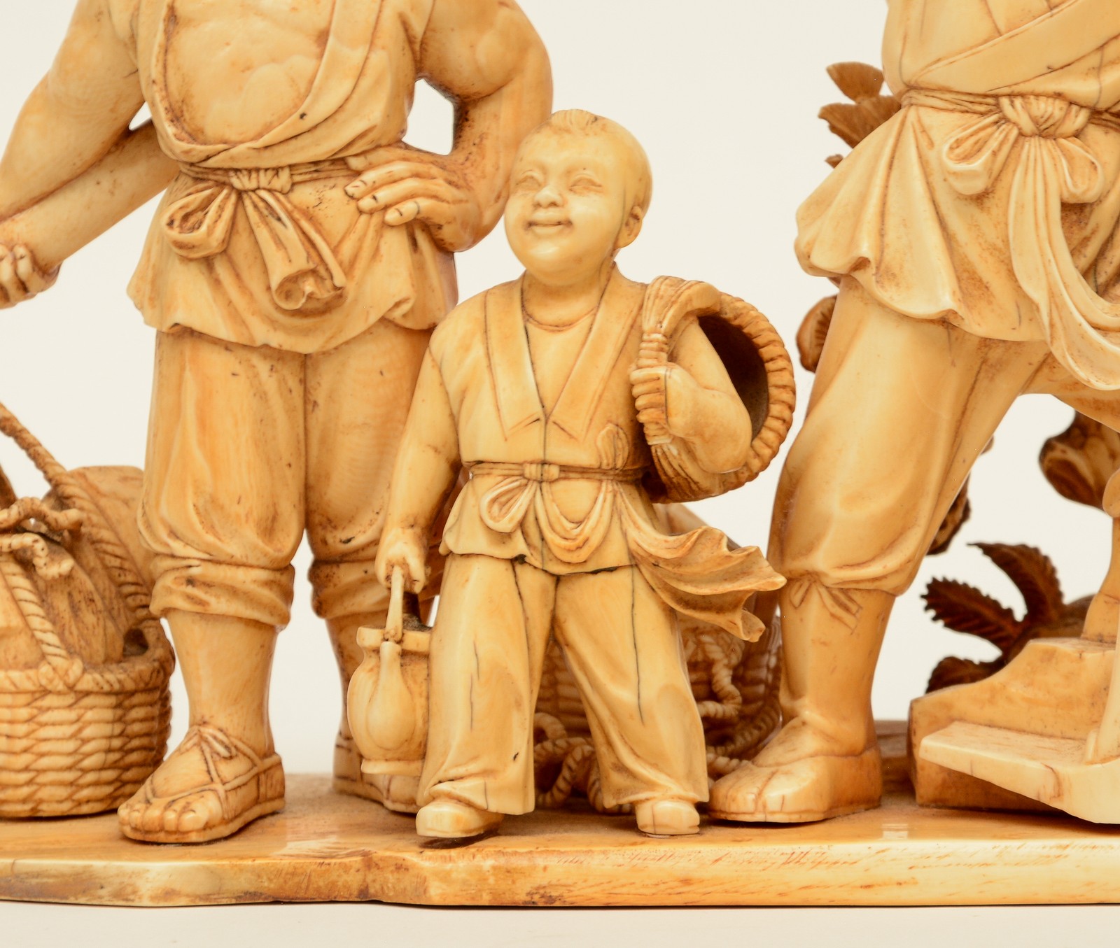 A Chinese ivory group depicting a rural scene, on a carved wooden base, first half 20thC, H 22,5 ( - Image 12 of 13