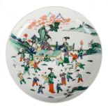 A Chinese famille verte decorated plate with figures and children in a garden, marked Chenghua, H