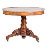 A round mahogany veneered second half of the19thC table with sculpted feet and a rouge royal