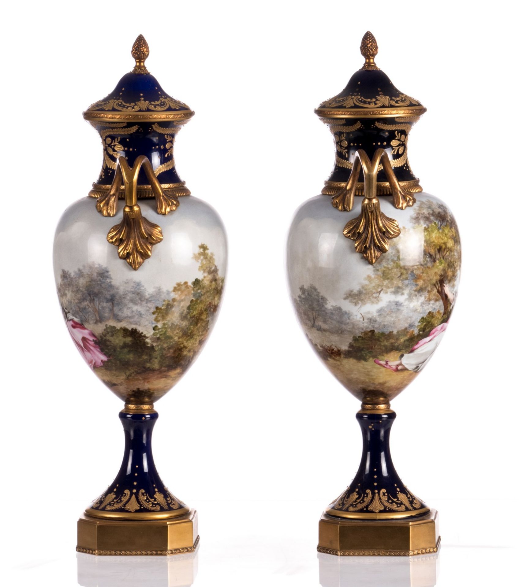 A pair of ornamental vases in Sèvres with gold-layered blue royale ground, decorated with a - Image 2 of 8