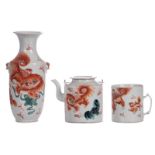A Chinese iron red and polychrome vase, a teapot and cover and a beaker, decorated with Fû-lions,