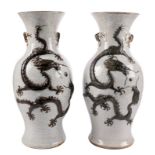 Two Chinese stoneware vases with crackleware and dragon relief decorated, marked, 19thC, H 45,5 cm