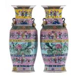 A pair of Chinese famille rose and polychrome hexagonal vases, overall decorated with animated