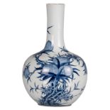 A Chinese blue and white nine peaches bottle vase, marked Qianlong, H 38,5 cm