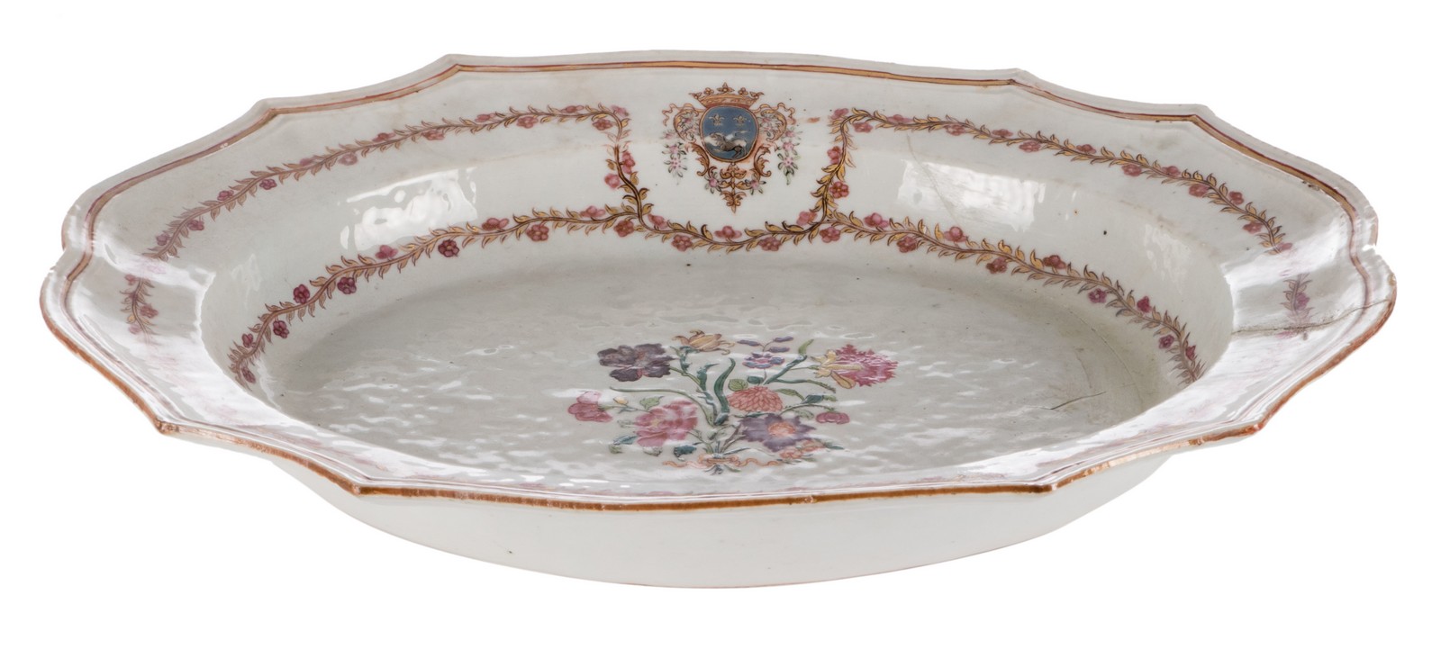 A Chinese dish with profiled edge and famille rose decorated, 18thC, 31 x 39 cm (restoration)