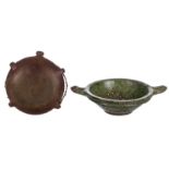 A 19thC stoneware canteen, W 27,5 cm; added a 19thC green glazed earthenware colander, W 40,5 cm