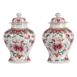 A pair of Chinese famille rose vases and covers, decorated with flower branches, H 34 cm