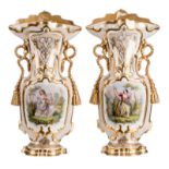 A pair of ornamental vases in Brussels porcelain depicting gallant ladies, the gold paint in good
