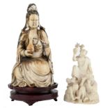 A Chinese ivory Guanyin,ivory with coloured engraving decoration, on a matching wooden base, about