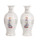 A pair of Chinese polychrome decorated baluster shaped vases with figures and calligraphic texts,