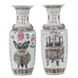 A pair of Chinese famille rose vases, decorated with flower vases, and baskets, and calligraphic