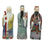 Three Chinese polychrome decorated 'Fu Lu Shou Shing' figures, marked, about 1900, H 61 - 63 cm (