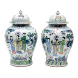 Two fine Chinese wucai vases and covers, overall decorated with a garden scene, marked Kangxi, H