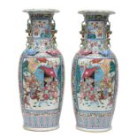 A pair of Chinese famille rose vases, decorated with warriors and a court scene, 19thC, H 64 cm