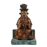 A Chinese bronze and gilt lacquered Bodhisattva and child, most probably Ming and period, on a base,