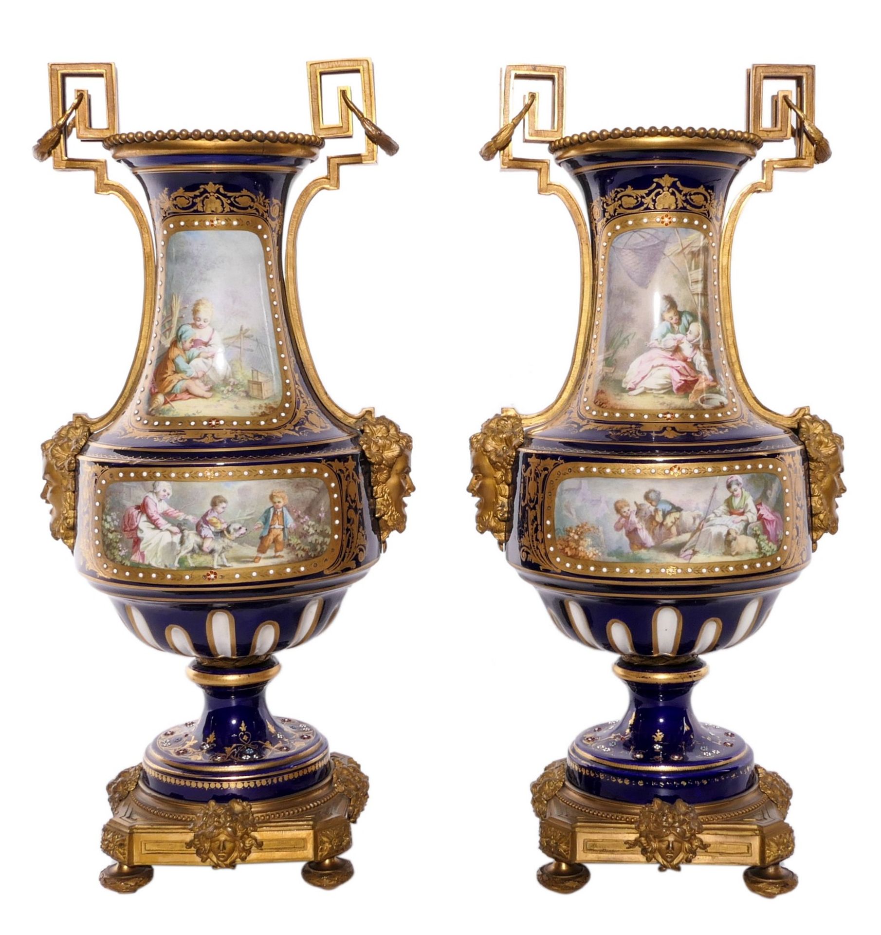 A pair of Neoclassical vases in Sèvres-porcelain, blue royale ground, the front with gilt cartouches