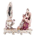 'The toilet', a polychrome decorated figural Saxony porcelain group, marked, H 41 - B 37 cm