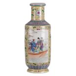 A Chinese yellow ground famille rose rouleau shaped vase, the roundels decorated with animated