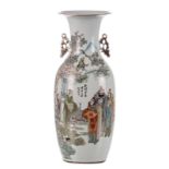 A Chinese polychrome vase, decorated with an animated scene, signed, H 56,5 cm