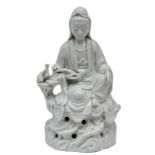 A Chinese 'Blanc de Chine' statue of a Guanyin, marked, 20thC, H 24 cm