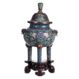 A Chinese cloisonné tripod incense burner decorated with floral motifs and auspicious symbols, the