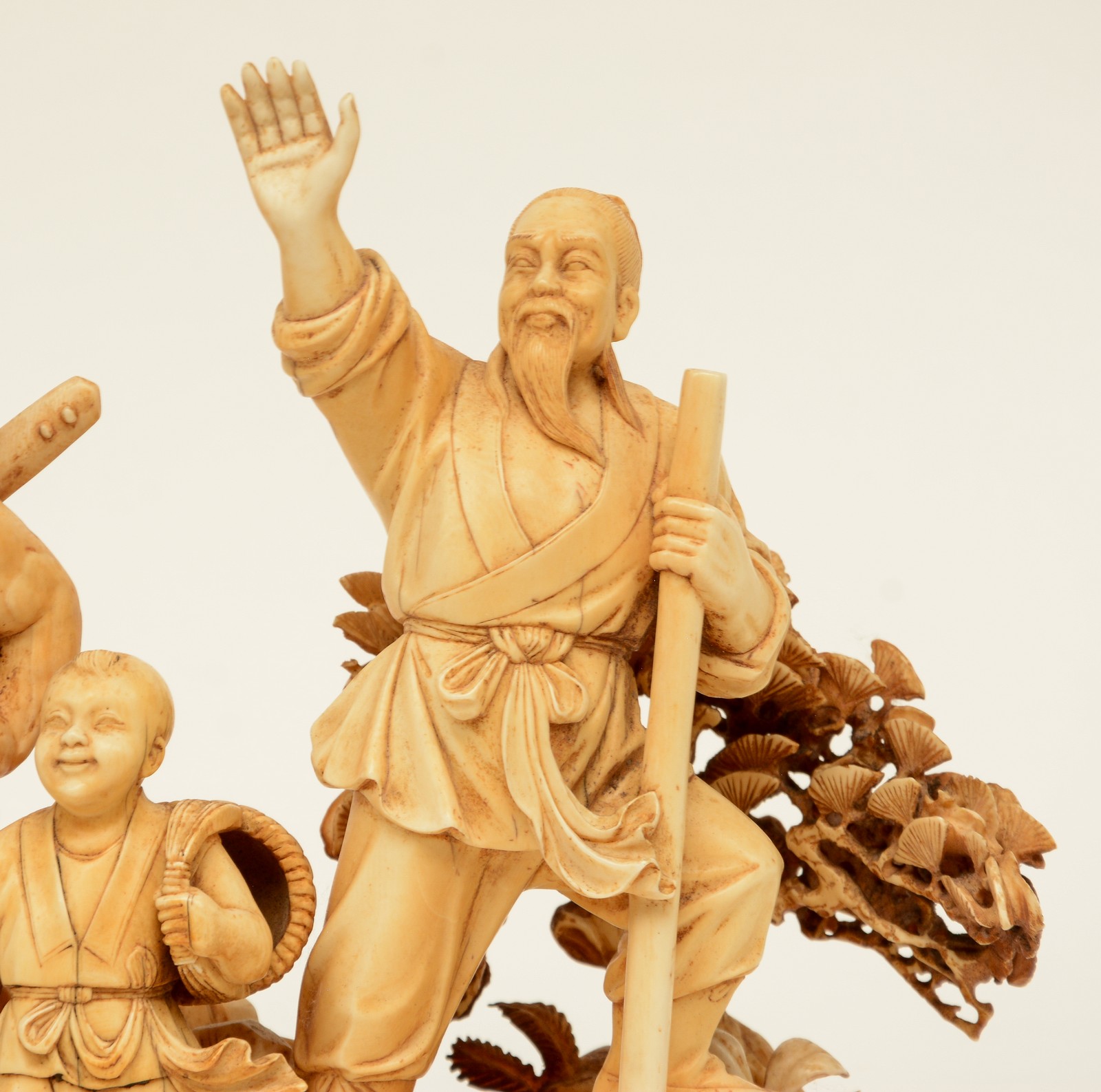 A Chinese ivory group depicting a rural scene, on a carved wooden base, first half 20thC, H 22,5 ( - Image 10 of 13