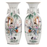 A Pair of Chinese polychrome decorated vases with a lady and playing children in a garden, H 57,5