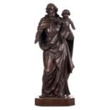 A 19thC oak sculpture depicting the Holy Joseph and the child, on a ditto base of a later date, H 97