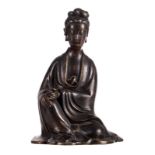 A Chinese bronze patinated seated Guanyin, H 15 cm