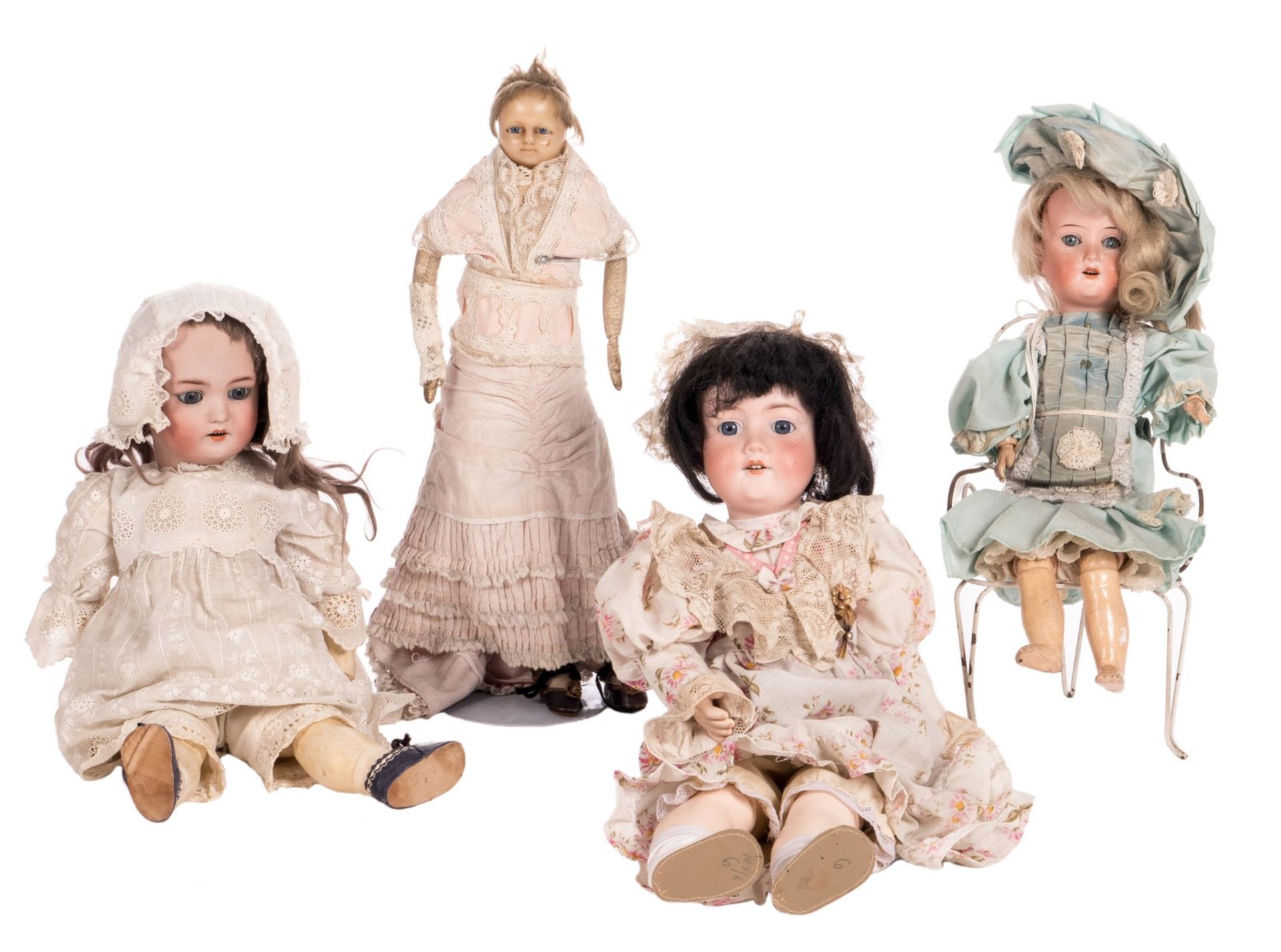 Four dolls: an English wax doll, about 1850; Simon & Halbig n° 1078, about 1900; Schoenau &