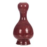 A Chinese sang de boeuf double gourd vase with a Yongzheng mark, H 43,5 cm (chips to the rim and